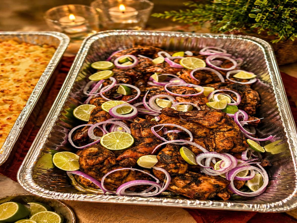 Tandoori chicken on a bed of sliced onions and lemon